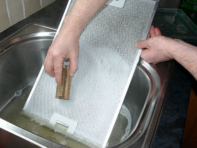 Continue to scrub dipping the brush frequently in the hot water